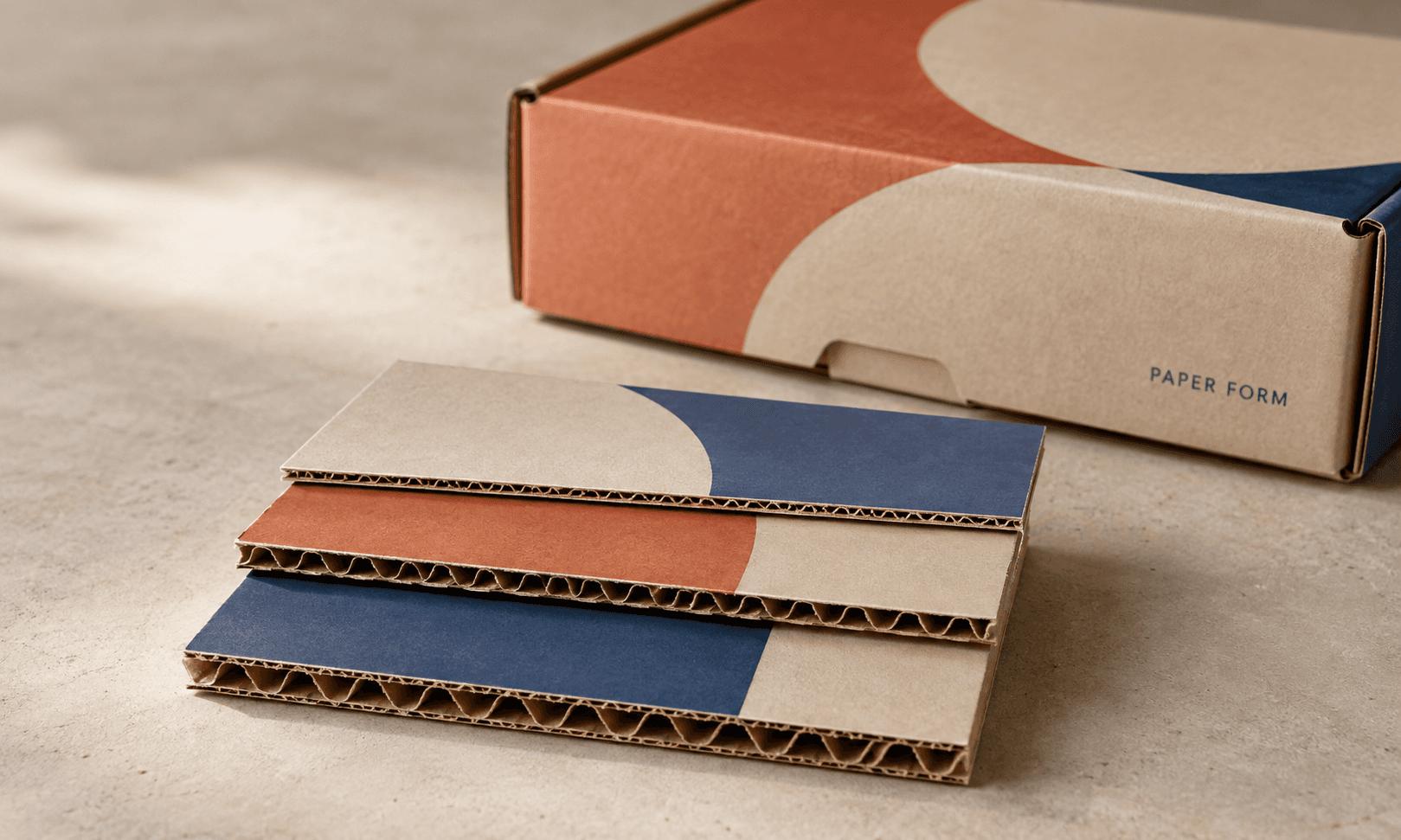 Three corrugated board samples reveal the fine E-flute, medium B-flute and deeper C-flute profiles.